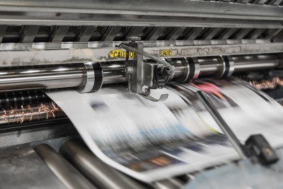 A newspaper printing press in action