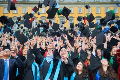 Students throw their hats