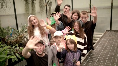 Children wave at the camera