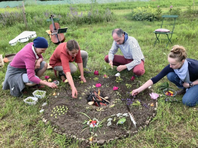 People decorate a bonfire