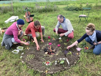 People decorate a bonfire