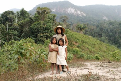 Children in front of a bush