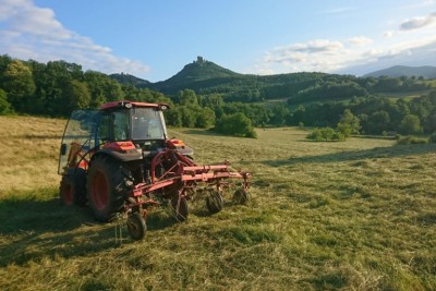 A tractor works a field