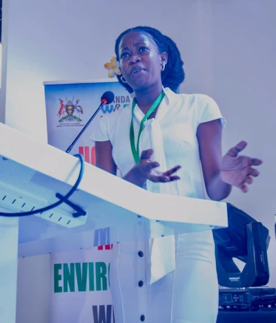 Laura Muwanguzi at a desk